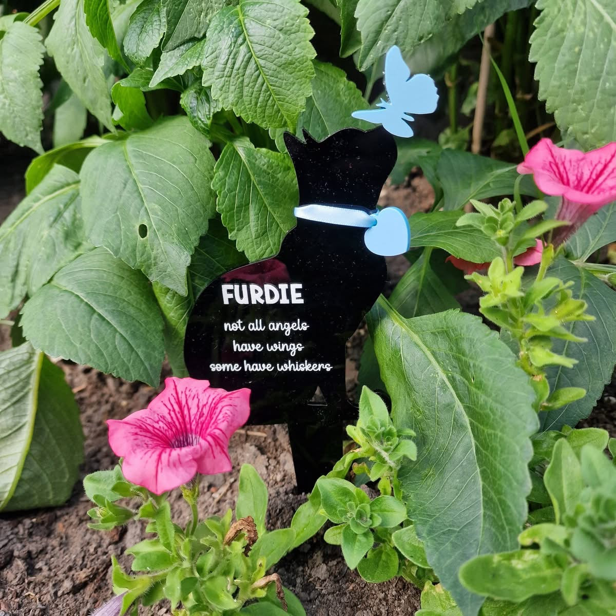 Cat with butterfly grave marker