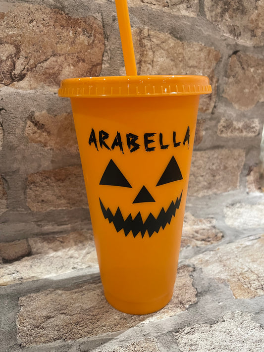 Personalised orange Halloween cold cup with pumpkin face and the name Arabella